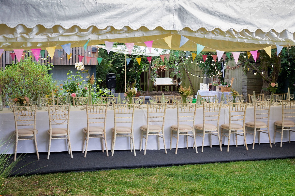 Dressed table under a garden marquee